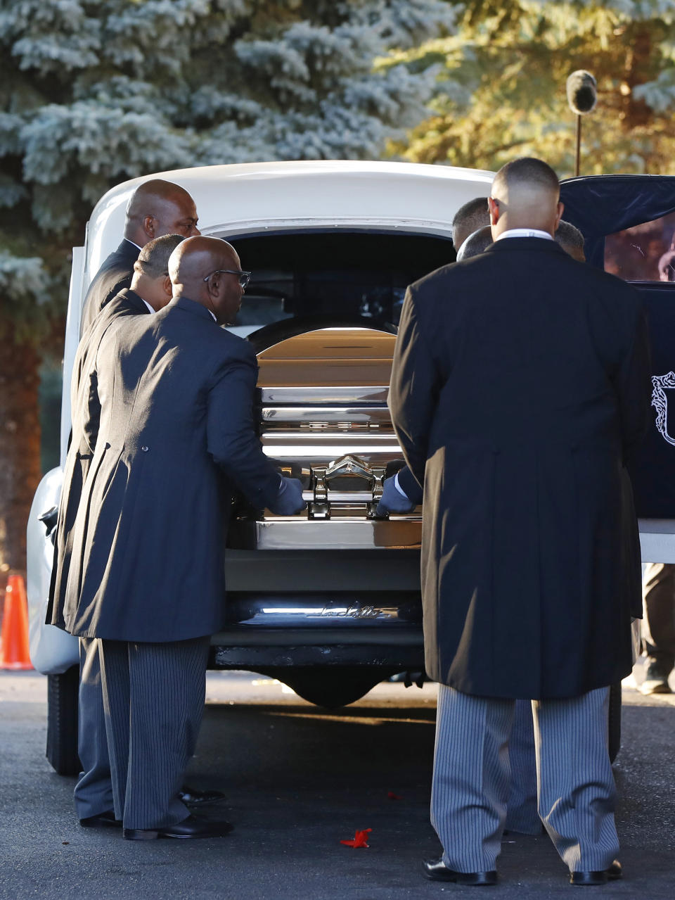 Pallbearers carry the gold casket of legendary singer Aretha Franklin after arriving at the Greater Grace Temple in Detroit, Friday, Aug. 31, 2018. Franklin died Aug. 16 of pancreatic cancer at the age of 76. (AP Photo/Paul Sancya)