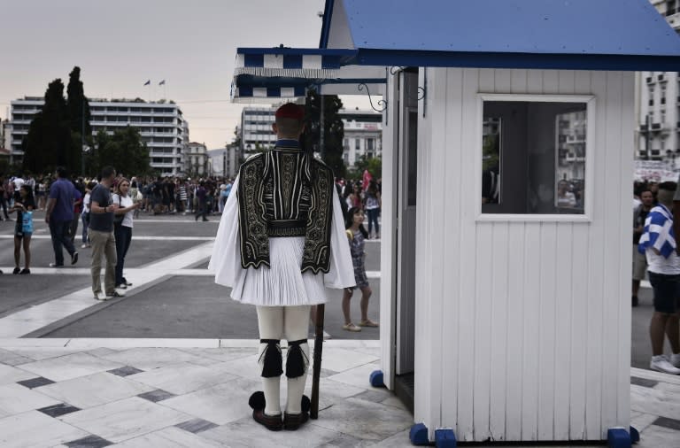 A member of the Greek presidential guard stands at his post in front of the parliament in Athens