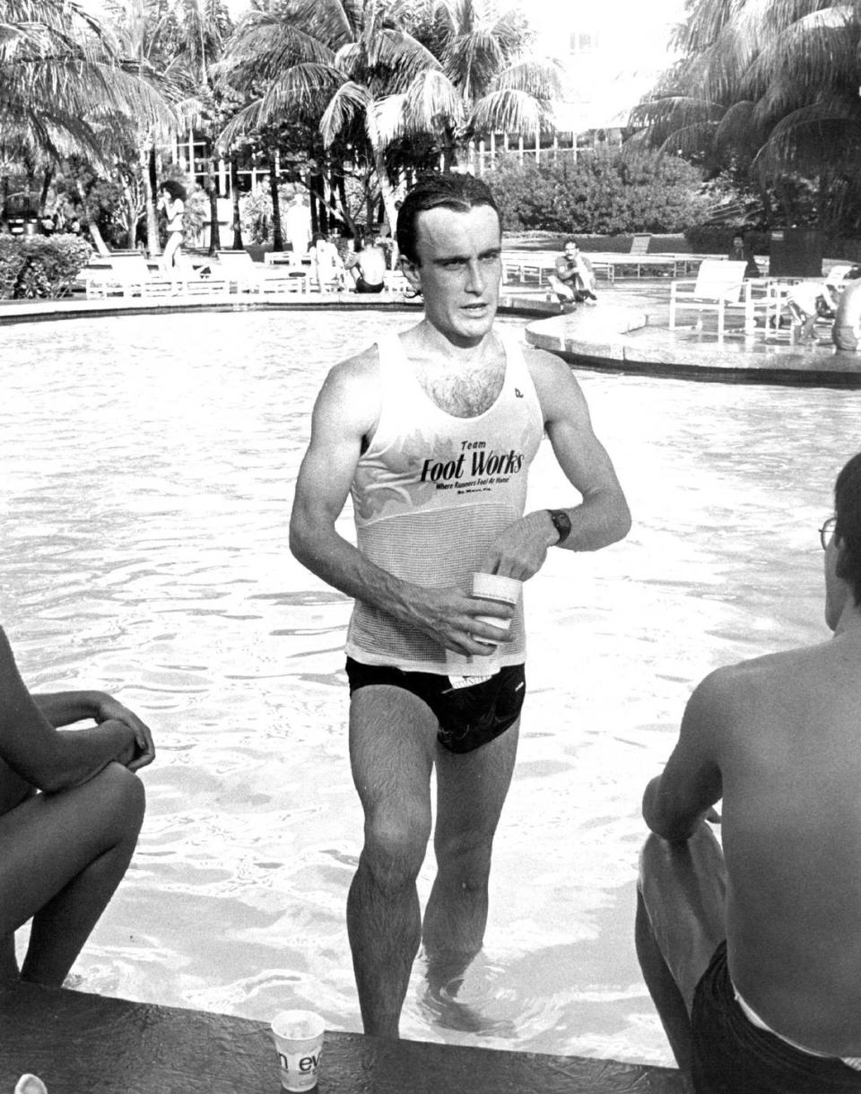 In 1983, Bob Dugan cools his winning feet in the Fontainebleau Hilton pool after clocking a 48 minute 32 second time in the Fifth Annual Electric Island Run.