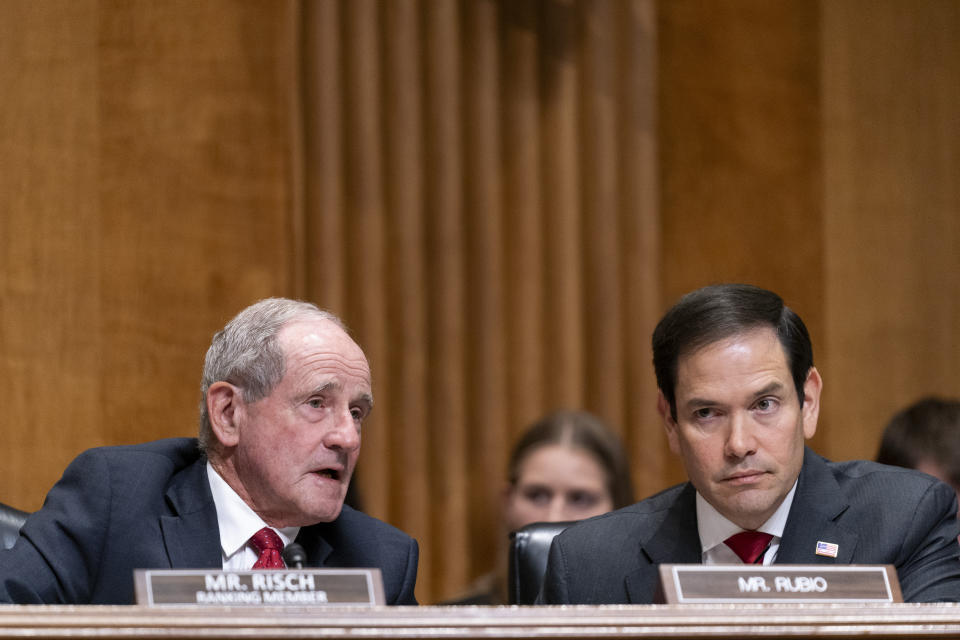 Senate Foreign Relations Committee Ranking Member Sen. Jim Risch, R-Idaho, left, speaks to Sen. Marco Rubio, R-Fla., right, during a committee hearing to examine the nomination of Jacob Lew, former treasury secretary under President Barack Obama, as Ambassador to the State of Israel, Wednesday, Oct. 18, 2023, in Washington. (AP Photo/Stephanie Scarbrough)