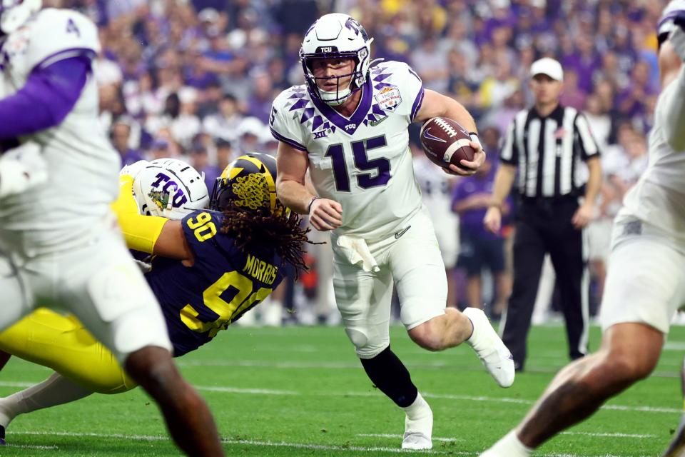 Dec 31, 2022; Glendale, Arizona, USA; TCU Horned Frogs quarterback Max Duggan (15) runs in the first quarter against the Michigan Wolverines in the 2022 Fiesta Bowl at State Farm Stadium. Mandatory Credit: Mark J. Rebilas-USA TODAY Sports