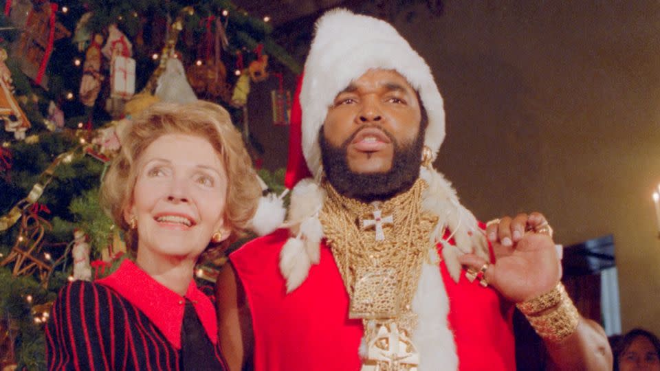 <strong>1983</strong>: Nancy Reagan posed with the actor Mr. T, dressed as Santa Claus, unveiling the White House Christmas decorations together. - Bettmann Archive/Getty Images