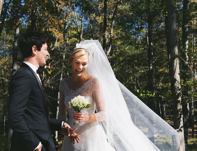 <p>Model Karlie Kloss married boyfriend Joshua Kushner in a surprise ceremony just three months after their engagement in July. Posting a rare Instagram pic, Kloss revealed her custom Dior wedding dress with lace overlay and impressive veil with the caption, '10.18.2018 ❤️'. According to <a href="https://people.com/style/karlie-kloss-marries-joshua-kushner/" rel="nofollow noopener" target="_blank" data-ylk="slk:People;elm:context_link;itc:0;sec:content-canvas" class="link ">People</a>, the ceremony was small, about 80 people, and took place in upstate New York on Thursday evening.</p><p><a href="https://www.instagram.com/p/BpGCiGlHqME/?taken-by=karliekloss" rel="nofollow noopener" target="_blank" data-ylk="slk:See the original post on Instagram;elm:context_link;itc:0;sec:content-canvas" class="link ">See the original post on Instagram</a></p>