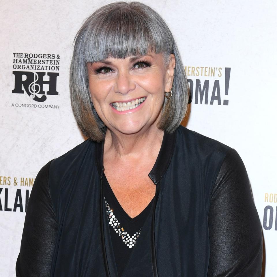 Dawn French smiles against a monochrome backdrop