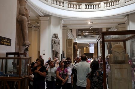 FILE PHOTO: Tourists look at artefacts inside the Egyptian Museum in Cairo