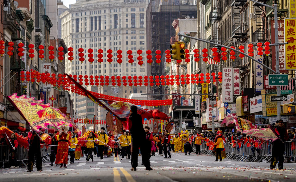 Participants march during the Lunar New Year parade in Manhattan's Chinatown neighborhood, in New York, Sunday, Feb. 9, 2020. (AP Photo/Craig Ruttle)