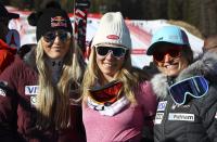 FILE - From left, United States' Lindsey Vonn, Mikaela Shiffrin and Julia Mancuso pose after an alpine ski, women's World Cup super-G, in Cortina d'Ampezzo, Italy, Sunday, Jan. 29, 2017. Mikaela Shiffrin's record 83rd World Cup victory Tuesday, Jan. 24, 2023 is only the latest exploit by an American team that has been producing success after success on the circuit since Daron Rahlves and Bode Miller started it all off more than 20 years ago. (AP Photo/Alessandro Trovati, File)