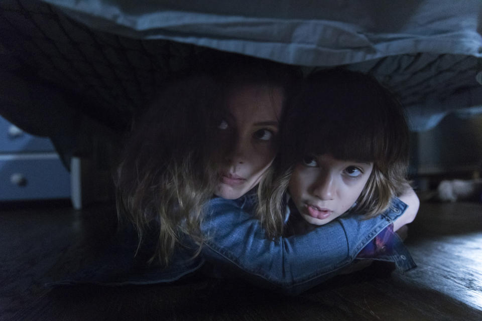 This image released by Focus Features shows Gillian Jacobs, left, and stars Azhy Robertson in a scene from "Come Play." The biggest theater release since reopening began in late August is “Tenet,” which is still playing on around 1,800 screens. Current offerings widely available also include a Liam Neeson thriller, “Honest Thief,” a PG-13 horror movie with Gillian Jacobs called “Come Play.” (Jasper Savage/Amblin Partners - Focus Features via AP)