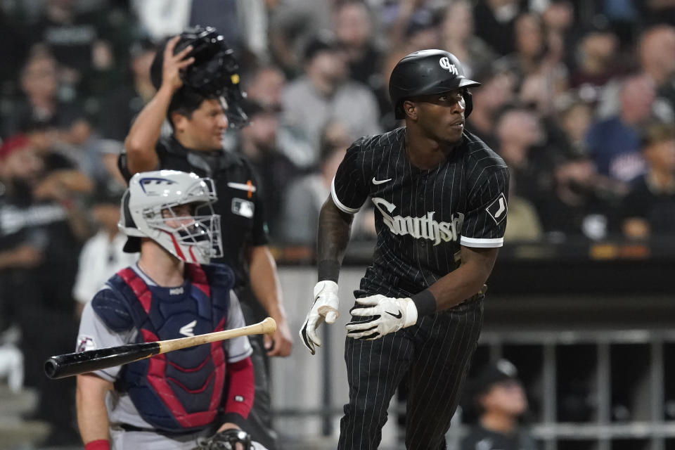 Chicago White Sox's Tim Anderson watches his RBI double off Cleveland Guardians starting pitcher Zach Plesac during the seventh inning of a baseball game Monday, May 9, 2022, in Chicago. Leury Garcia scored on the play. (AP Photo/Charles Rex Arbogast)