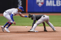Miami Marlins' Starling Marte, right, steals second against New York Mets second baseman Jeff McNeil, left, in the fourth inning of a baseball game, Saturday, April 10, 2021, in New York. (AP Photo/John Minchillo)