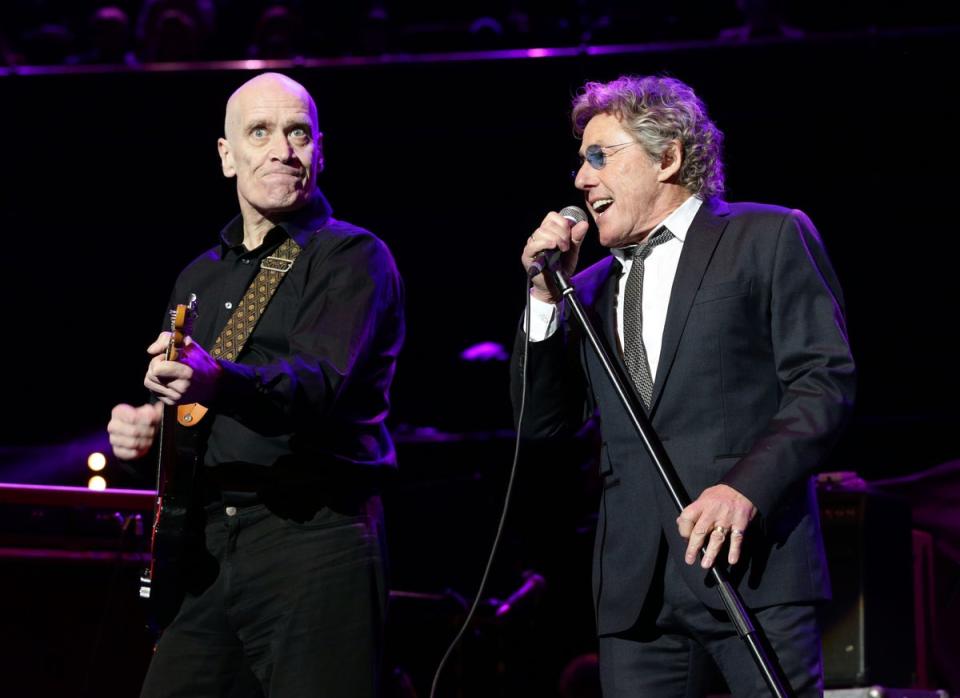 Wilko Johnson performing with Roger Daltrey (PA)