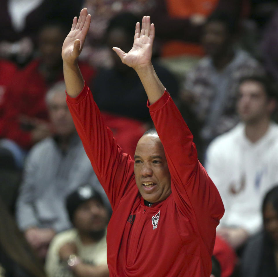North Carolina State coach Kevin Keatts gestures during the first half of the team's NCAA college basketball game against Virginia Tech on Saturday, Jan. 7, 2023, in Blacksburg, Va. (Matt Gentry/The Roanoke Times via AP)