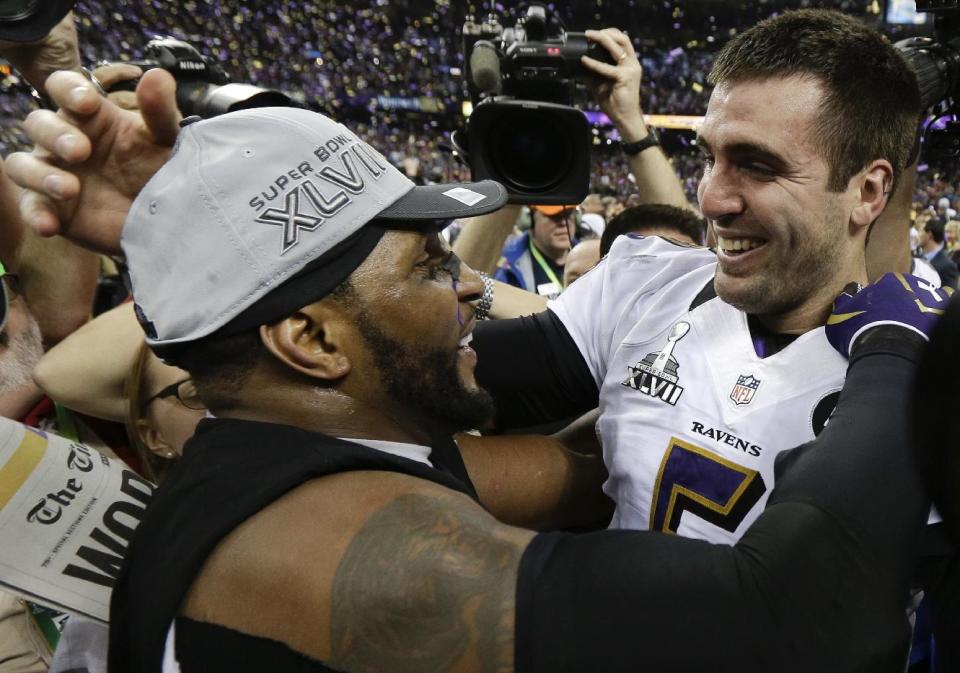 Baltimore Ravens linebacker Ray Lewis, left, and quarterback Joe Flacco celebrate their 34-31 win against the San Francisco 49ers in the NFL Super Bowl XLVII football game, Sunday, Feb. 3, 2013, in New Orleans. (AP Photo/Julio Cortez)