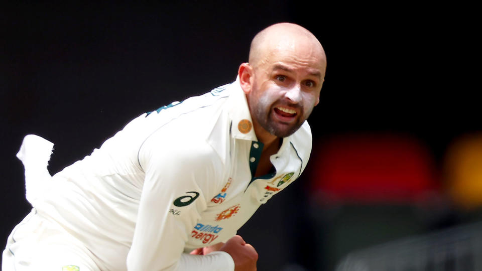 Pictured here, Nathan Lyon delivers a ball in a Test match for Australia.