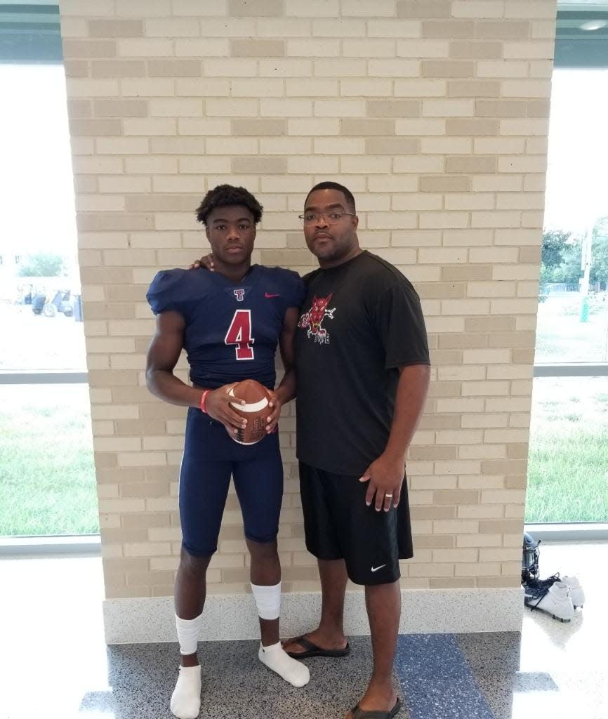 Jalen Milroe and his father, Quentin Milroe, in August of 2018.