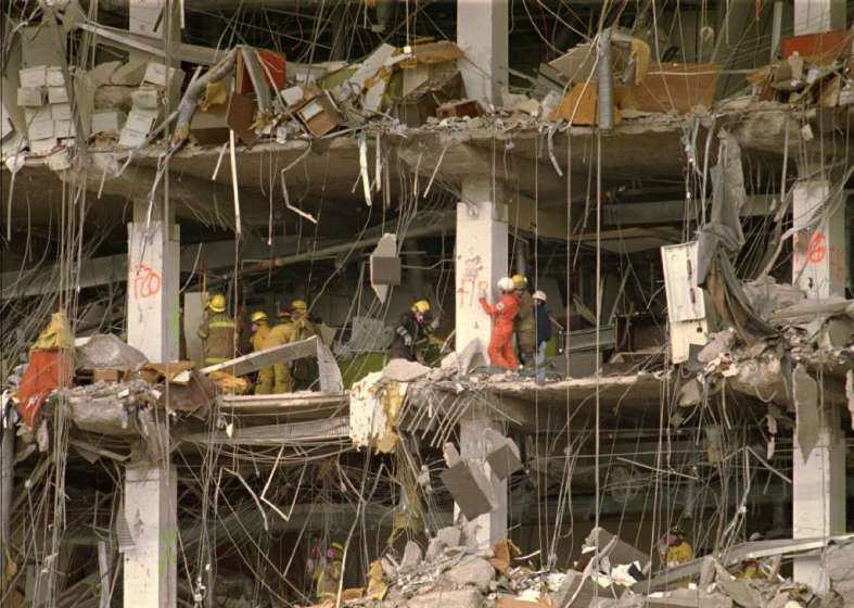 Investigators examine the wreckage of the Alfred P. Murrah Federal Building in 1995.