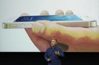 Phil Schiller, senior vice president of worldwide marketing for Apple Inc, talks about the new iPhone 5S at Apple Inc's media event in Cupertino, California September 10, 2013. REUTERS/Stephen Lam (UNITED STATES - Tags: BUSINESS SCIENCE TECHNOLOGY BUSINESS TELECOMS)