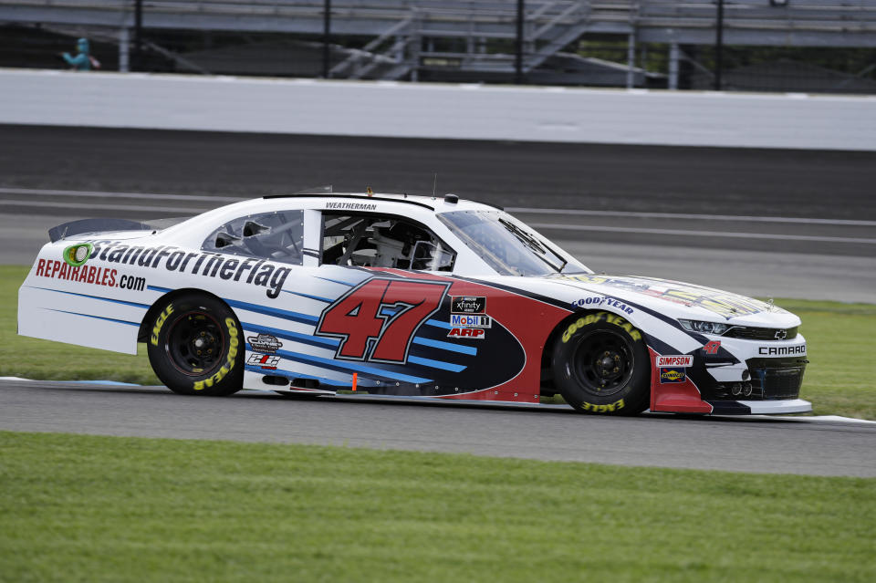 NASCAR Xfinity Series driver Kyle Weatherman drives through a turn during practice for the NASCAR Xfinity Series auto race at Indianapolis Motor Speedway in Indianapolis, Friday, July 3, 2020. The car carries the hashtag #standfortheFlag and features a We Stand for the National Anthem paint scheme. (AP Photo/Darron Cummings)