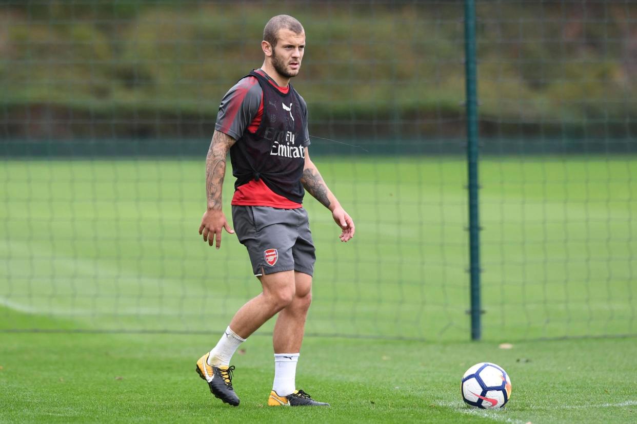 Left out: Substitute Wilshere was readied against Watford but never made it on: Arsenal FC via Getty Images