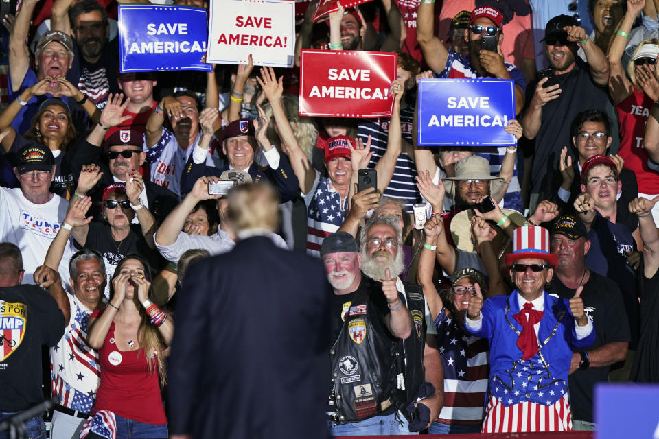 FILE - Supporters cheer on former President Donald Trump after he spoke at a rally at the Lorain County Fairgrounds, June 26, 2021, in Wellington, Ohio. A review by The Associated Press in the six battleground states disputed by former President Trump has found fewer than 475 cases of potential voter fraud, a minuscule number that would have made no difference in the 2020 presidential election. Democrat Joe Biden won Arizona, Georgia, Michigan, Nevada, Pennsylvania and Wisconsin and their 79 Electoral College votes by a combined 311,257 votes out of 25.5 million ballots cast for president. (AP Photo/Tony Dejak)