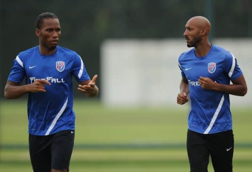 Shanghai Shenhua players Didier Drogba (L) and Nicolas Anelka during a team training session in Shanghai on July 16. The match on Sunday was notable for being the first time Drogba and Anelka have played together at Shenhua