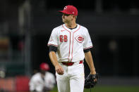 Cincinnati Reds pitcher Carson Spiers walks to the dugout after the top of the sixth inning of the team's baseball game against the Milwaukee Brewers on Tuesday, April 9, 2024, in Cincinnati. (AP Photo/Jeff Dean)