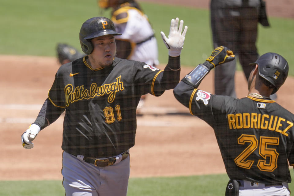 Pittsburgh Pirates' Ji Man Choi (91) celebrates with teammate Endy Rodriguez after hitting a home run during the second inning of a baseball game against the San Diego Padres, Wednesday, July 26, 2023, in San Diego. (AP Photo/Gregory Bull)