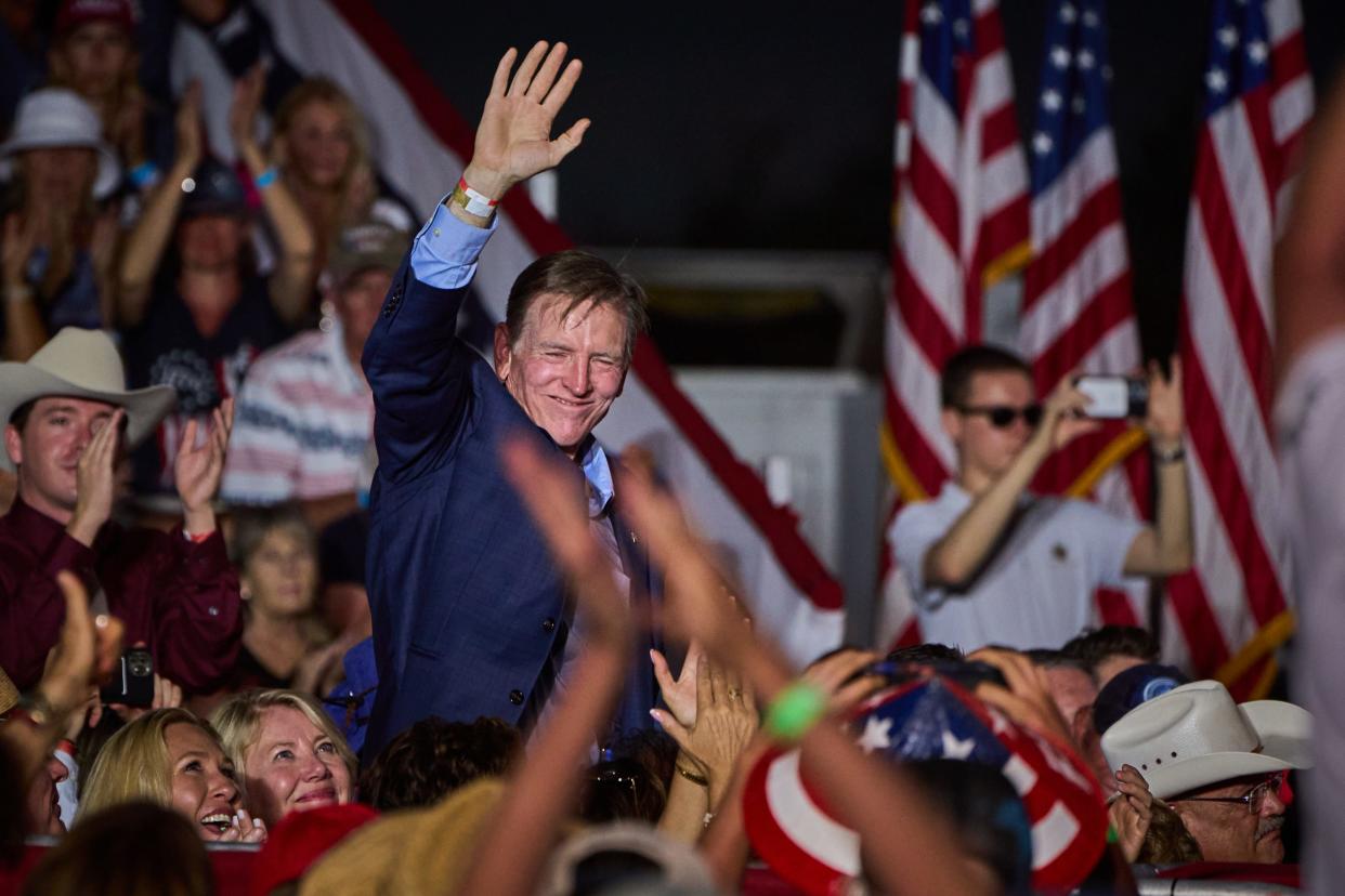 U.S. Rep. Paul Gosar waves to the crowd during former President Donald Trump's rally at Legacy Sports Park in Mesa on Sunday, Oct. 9, 2022.