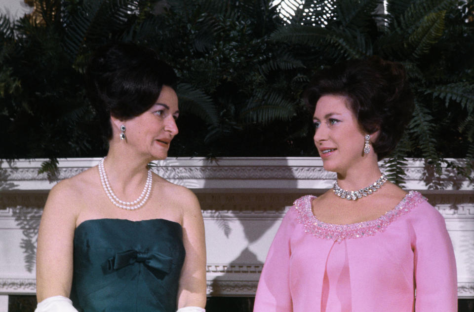 Margaret chats with first lady Lady Bird Johnson before a White House dinner.