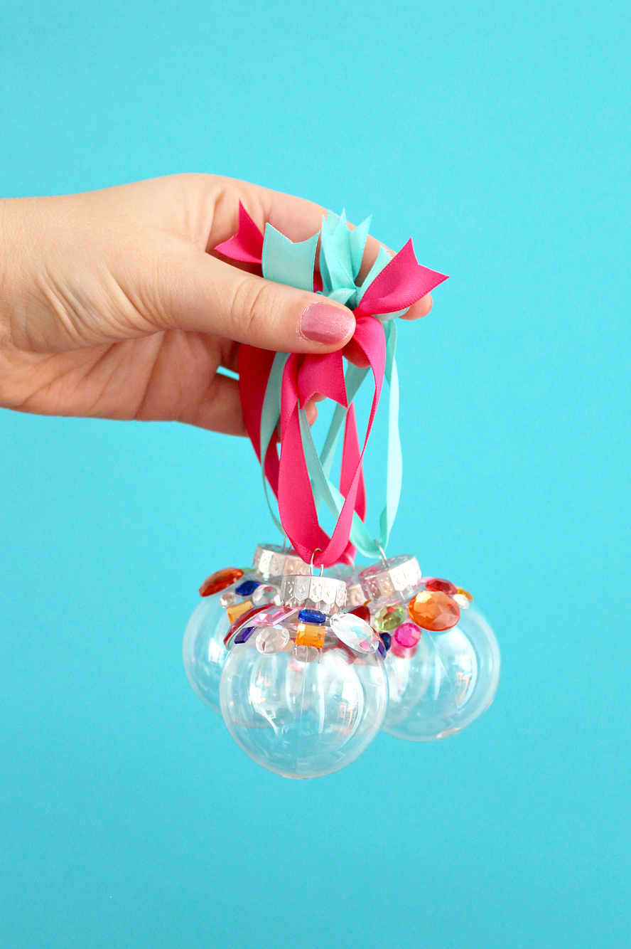 <p>Make your tree sparkle and shine by gluing a handful of colorful rhinestones to clear plastic baubles. </p><p><em><a href="https://www.whitehousecrafts.net/post/2017/12/06/diy-colourful-rhinestone-ornaments" rel="nofollow noopener" target="_blank" data-ylk="slk:Get the tutorial at White House Crafts »;elm:context_link;itc:0;sec:content-canvas" class="link ">Get the tutorial at White House Crafts »</a></em></p>