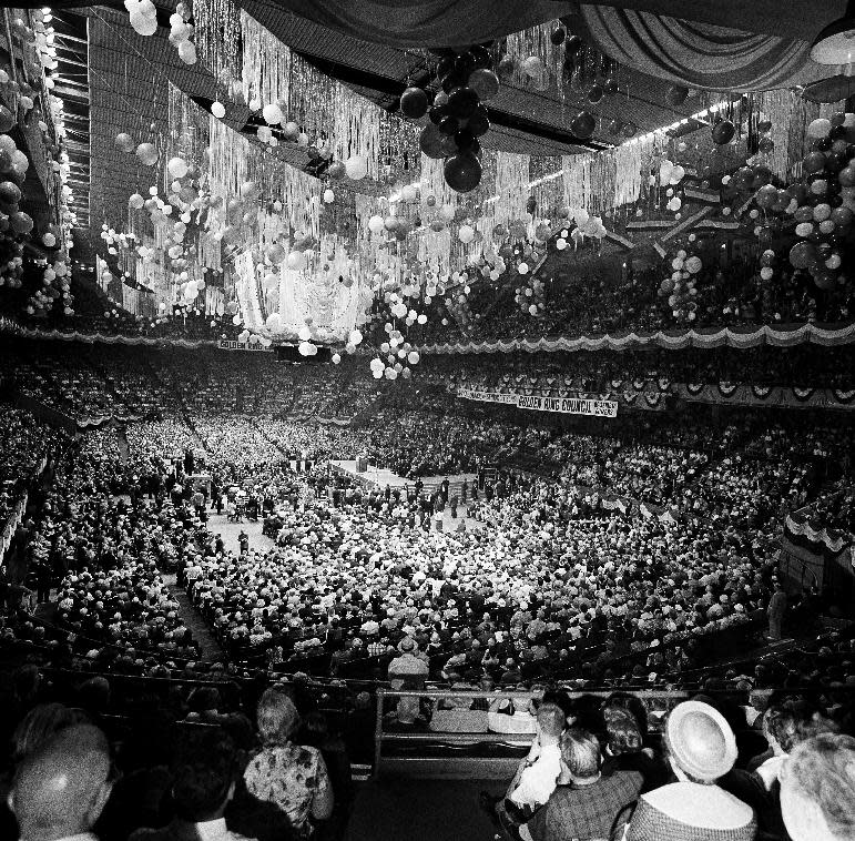 FILE - In this May 20, 1962, file photo elderly citizens fill New York’s Madison Square Garden to capacity as they hold a mass rally to hear President John F. Kennedy speak in support of his administration’s program for medical care for the elderly. The president said the arguments against his Medicare program are the same ones raised 25 years ago when social security was proposed. Though he made health care a major campaign issue, as president can't get a plan for the elderly through Congress. (AP Photo/File)