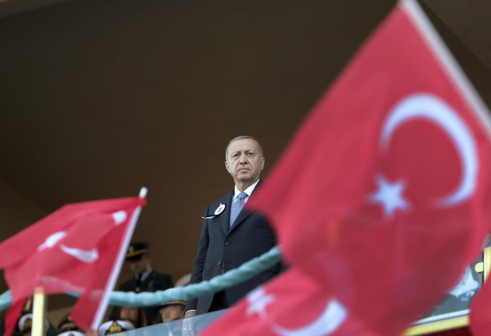 Turkey's President Recep Tayyip Erdogan attends a graduation ceremony of a military academy in Istanbul, Saturday, Aug. 31, 2019. Erdogan said the U.S. had up to three weeks to satisfy Turkish demands and has threatened to launch a unilateral offensive into northeastern Syria if plans to establish a so-called safe zone along Turkey's border fail to meet his expectations. Earlier this month, Turkish and U.S. officials agreed to set up the zone east of the Euphrates River. (Presidential Press Service via AP, Pool)