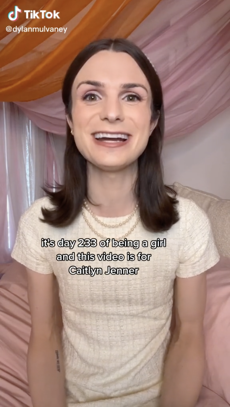 Screenshot of Dylan smiling with the caption, "it's day 233 of being a girl and this video is for Caitlyn Jenner"