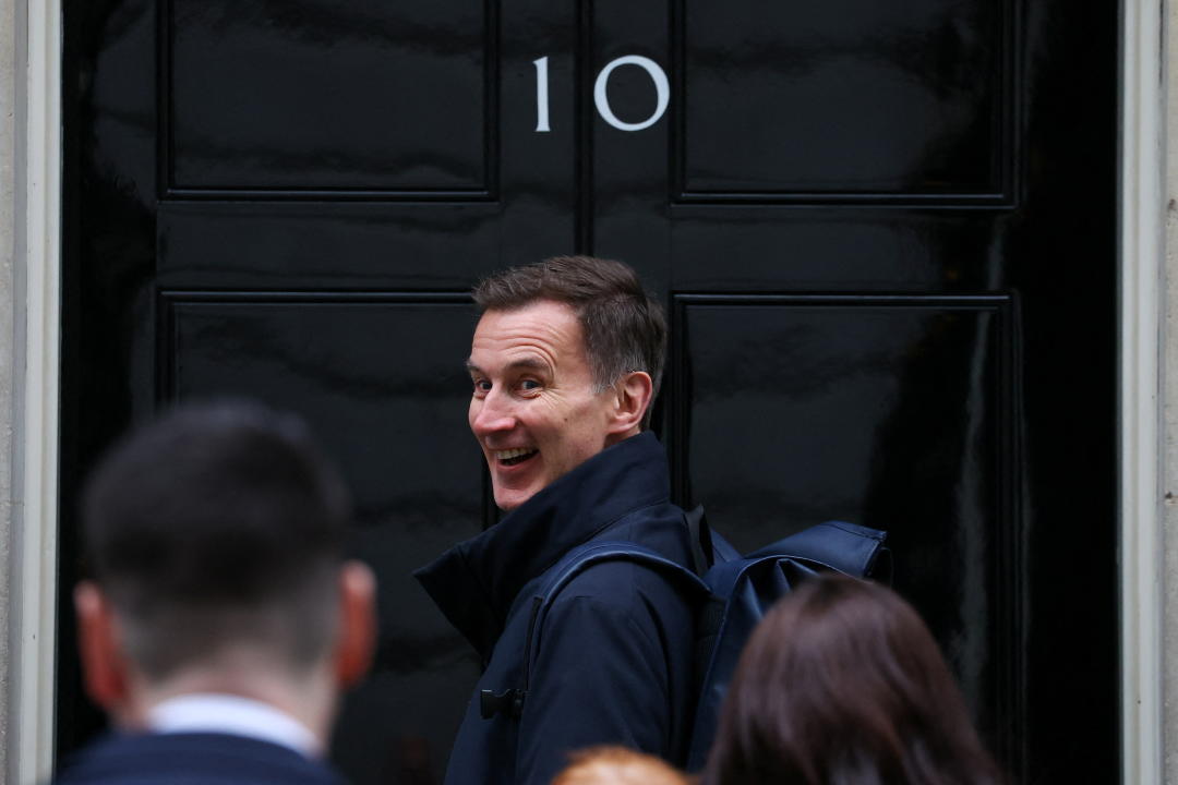 British Chancellor of the Exchequer Jeremy Hunt walks into Number 10 Downing Street in London, Britain, March 18, 2024. REUTERS/Toby Melville