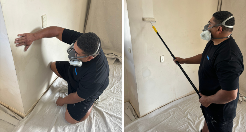 Frank Hoyt is pictured sanding and painting walls.