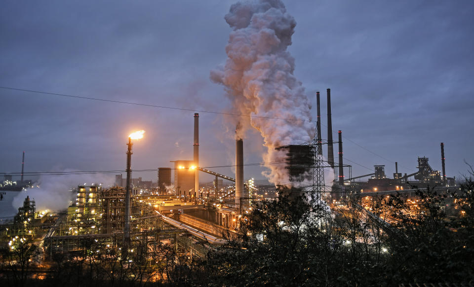 FILE - In this Jan. 30, 2020 file photo, a ThyssenKrupp coking plant steams around the clock for the nearby steel mill in Duisburg, Germany. The cuts in greenhouse gas emissions pledged by governments around the world aren't enough to achieve the headline goal of the Paris climate accord, according to a United Nations report published Friday. The U.N. climate office said it reviewed all the national commitments submitted by Paris pact signatories until July 30 and found that they would result in emissions of planet-warming gas rising nearly 16% by 2030, compared with 2010 levels. (AP Photo/Martin Meissner, File)