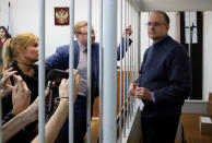 Former U.S. Marine Paul Whelan, who was detained on suspicion of spying, stands inside a defendants' cage as he attends a court hearing regarding the extension of his detention, in Moscow, Russia, May 24, 2019. REUTERS/Shamil Zhumatov