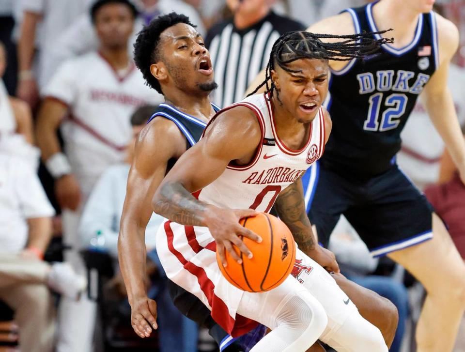 Arkansas’ Khalif Battle (0) gets around the defense of Duke’s Jeremy Roach (3) during the second half of Arkansas’ 80-75 victory over Duke at Bud Walton Arena in Fayetteville, Ark., Weds. Nov. 29, 2023.