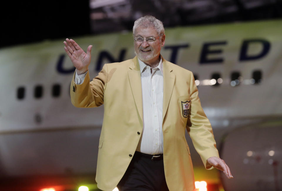 FILE - In this May 2, 2014, file photo, Ron Mix is introduced before the inaugural Pro Football Hall of Fame Fan Fest at the International Exposition Center in Cleveland. Ron Mix likes what he has seen and read regarding the new labor agreement between the NFL and its players. The Pro Football Hall of Famer, board member with the Pro Football Retired Players Association and retired attorney believes players from every generation will benefit from the deal struck last month that runs through the 2030 season. (AP Photo/Mark Duncan, File)