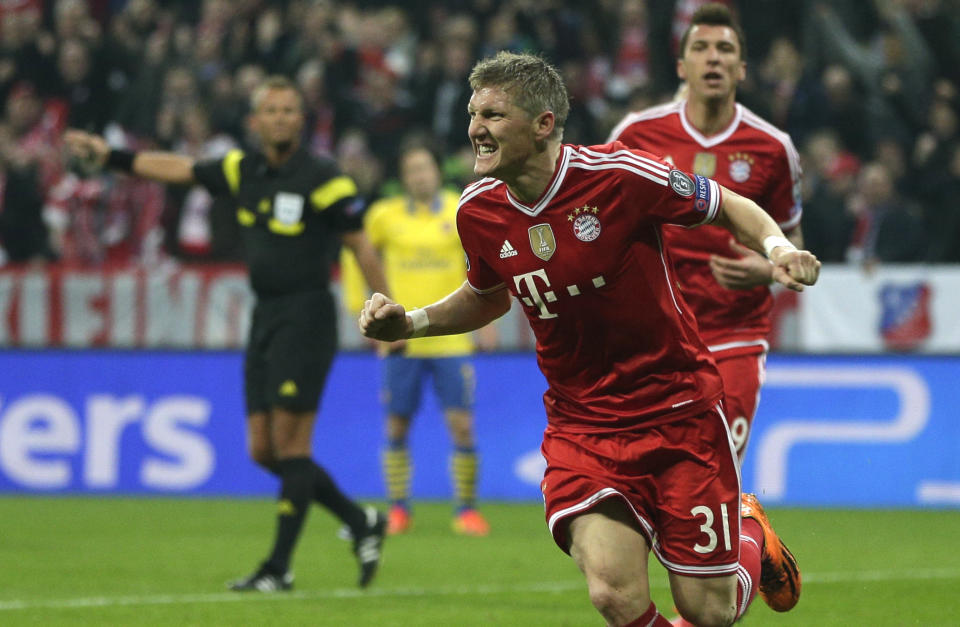 Bayern's Bastian Schweinsteiger celebrates scoring the opening goal during the Champions League round of 16 second leg soccer match between FC Bayern Munich and FC Arsenal in Munich, Germany, Wednesday, March 12, 2014. (AP Photo/Matthias Schrader)