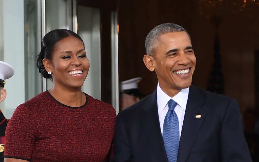 The Obamas are among the names on Emanuel’s client roster - AFP