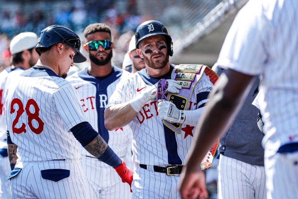 Detroit Tigers left fielder Robbie Grossman (8) celebrates a home run against the Texas Rangers during the first inning at Comerica Park in Detroit on Saturday, June 18, 2022.