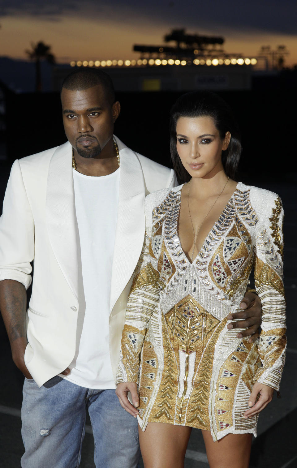 FILE - In this May 23, 2012 file photo, singer Kanye West, left, and television personality Kim Kardashian arrive for the screening of "Cruel Summer" at the 65th international film festival, in Cannes, southern France. West had many righteous things to rage about this year, from the fashion industry not giving him credit for brilliant, life-changing designs like leather jogging pants to not getting respect from President Barack Obama. But nothing seemed to upset him more than Vogue's apparent refusal to put his baby mama, Kardashian, on their cover. (AP Photo/Francois Mori, File)
