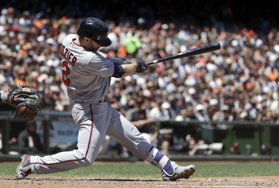 FILE - Minnesota Twins' Brian Dozier hits a two-run home run against the San Francisco Giants during the fifth inning of a baseball game in San Francisco, in this Saturday, June 10, 2017, file photo. Former Minnesota second baseman Brian Dozier has retired after nine years in the major leagues and 167 career home runs, the Twins announced on Thursday, Feb. 18, 2021. (AP Photo/Marcio Jose Sanchez, File)