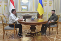 In this photo released by Indonesian Presidential Palace, Indonesian President Joko Widodo, left, shakes hands with his Ukrainian counterpart Volodymyr Zelensky during their meeting in Kyiv, Ukraine on Wednesday, June 29, 2022. Widodo, whose country holds the rotating presidency of the Group of 20 leading rich and developing nations, is currently on a tour to Ukraine and Russia for meetings with the leaders of the two warring nations following a visit to Germany to attend the Group of Seven summit. (Agus Suparto, Indonesian Presidential Palace via AP)