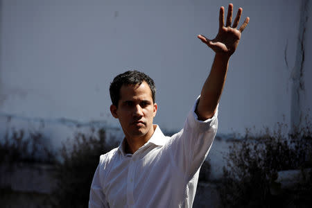 Juan Guaido, President of the Venezuelan National Assembly and lawmaker of the opposition party Popular Will (Voluntad Popular), salutes to supporters during a gathering in La Guaira, Venezuela January 13, 2019. REUTERS/Carlos Garcia Rawlins