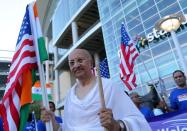 People celebrate before a "Howdy, Modi" rally celebrating India's Prime Minister Narenda Modi at NRG Stadium in Houston