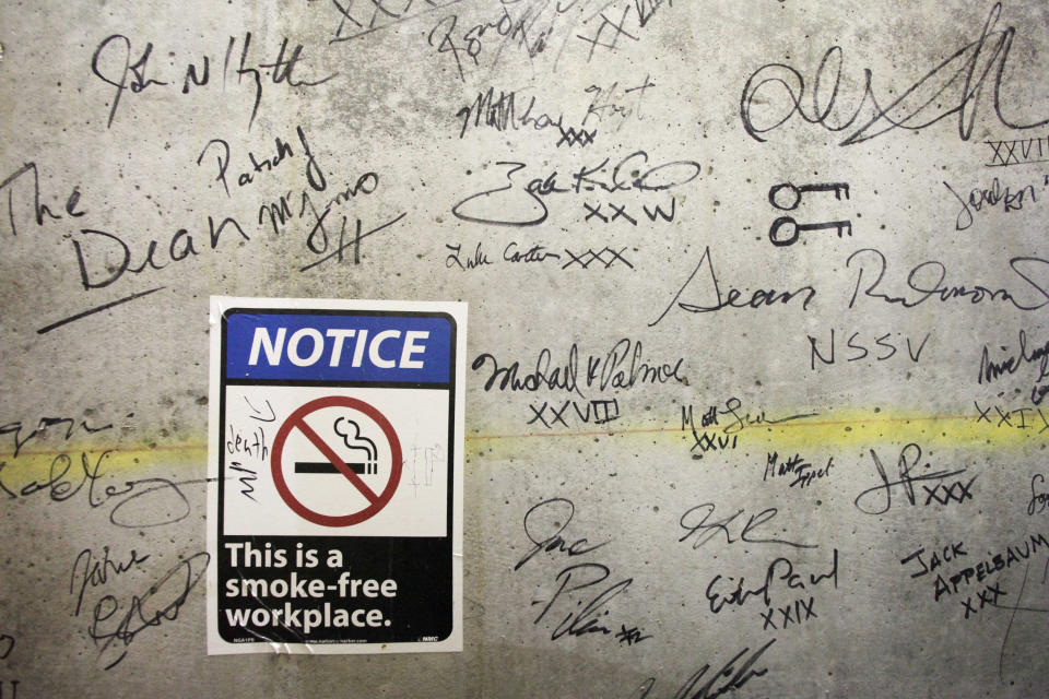 In this Jan. 15, 2013 photo, autographs cover a wall on a top floor of One World Trade Center in New York. Construction workers finishing New York's tallest building at the World Trade Center are leaving their personal marks on the concrete and steel in the form of graffiti. (AP Photo/Mark Lennihan)
