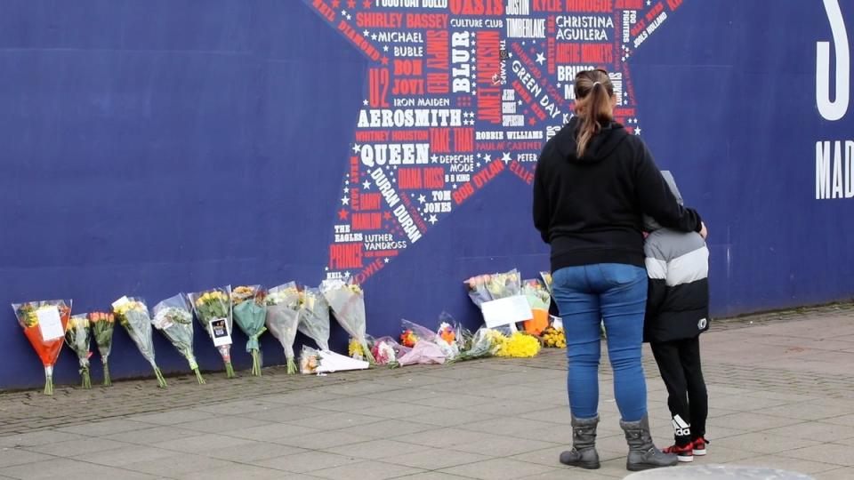 Tributes being laid outside the Sheffield arena where Johnson was killed (SWNS)