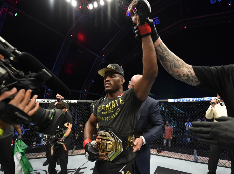 ABU DHABI, UNITED ARAB EMIRATES - JULY 12: Kamaru Usman of Nigeria celebrates after his victory over Jorge Masvidal in their UFC welterweight championship fight during the UFC 251 event at Flash Forum on UFC Fight Island on July 12, 2020 on Yas Island, Abu Dhabi, United Arab Emirates. (Photo by Jeff Bottari/Zuffa LLC)